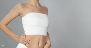 wrap around woman's breasts after cosmetic breast surgery.